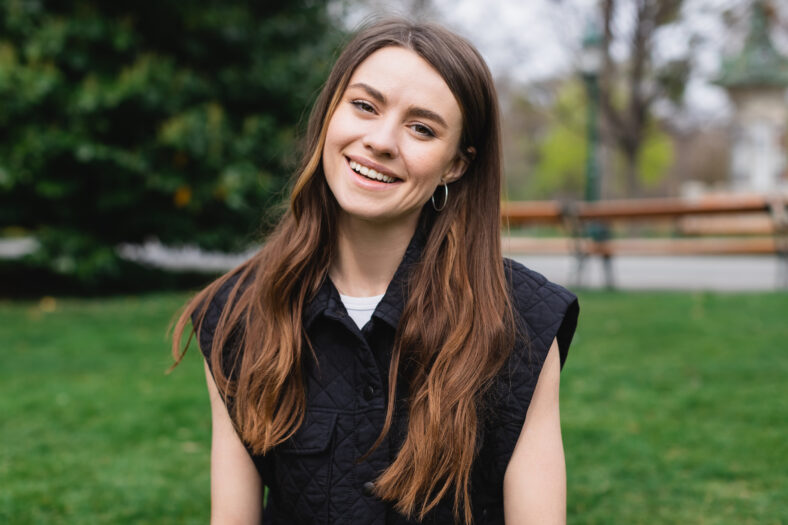 portrait of young cheerful woman in sleeveless jacket,stock image