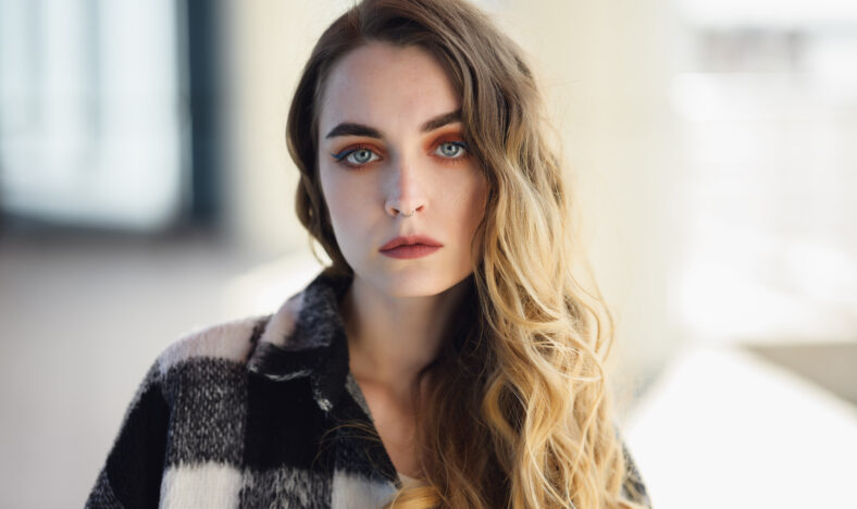 Portrait of young beautiful woman. Natural light. Shallow depth of field.