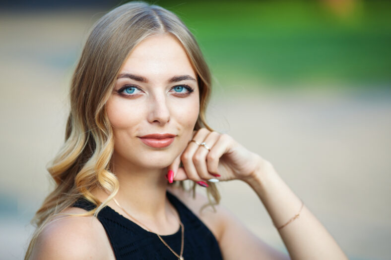 Beautiful face of a young woman. Outdoor portrait