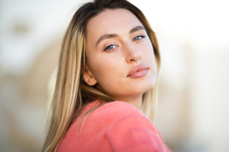 Close up face portrait beautiful young caucasian woman with blond hair