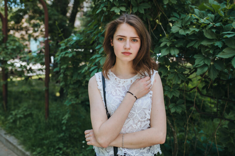 Beautiful young girl smiling in the park. healthy new life image