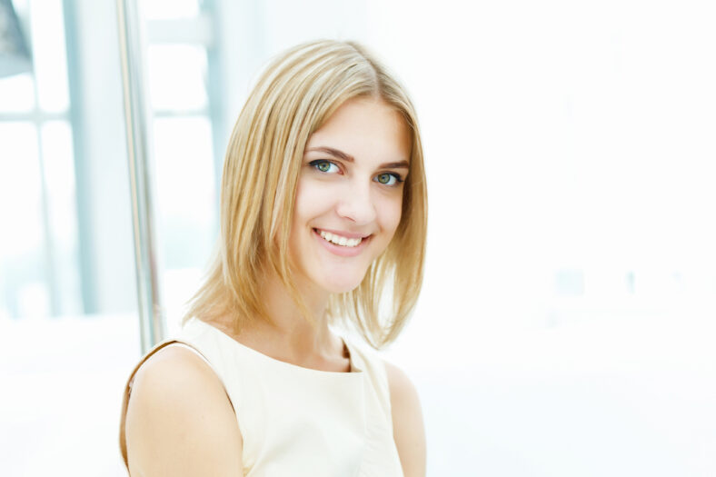 pretty young blonde woman with a bob haircut