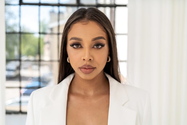 Elegant, confident woman with long lashes and delicate makeup looking at the camera. Sucessfull businesswoman. Closeup face of a beautiful girl.