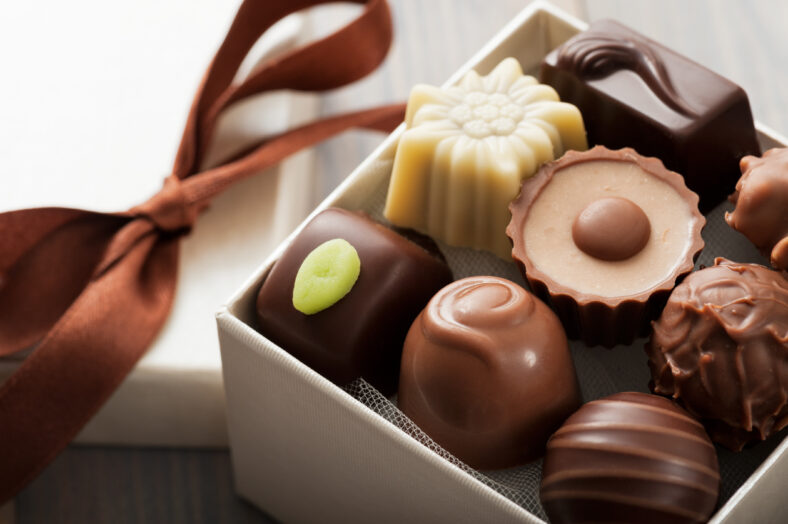 assorted chocolates confectionery in their gift box, close up