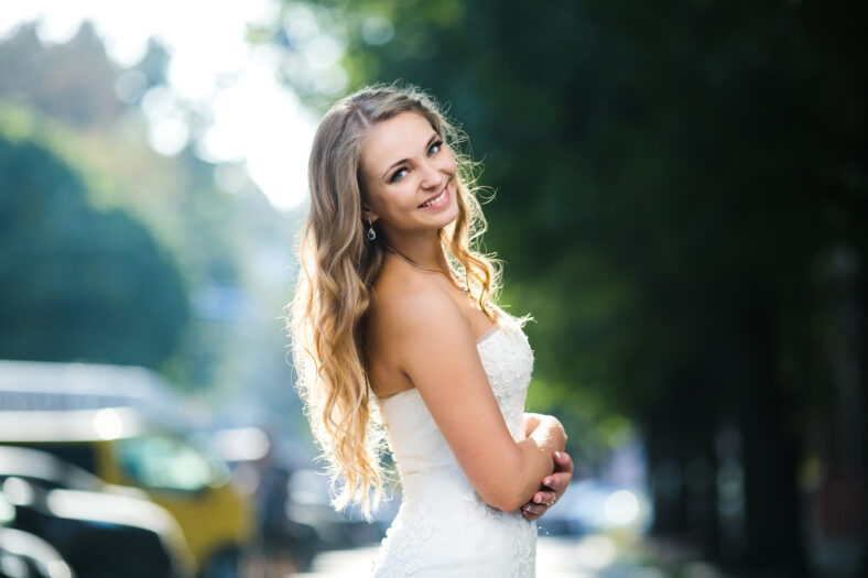 Beautiful bride posing against the backdrop of a European city