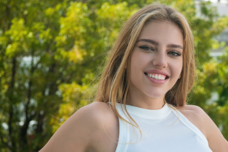 Beautiful woman with clean skin, natural make-up outdoor. Portrait of beautiful girl with perfect skin. Beauty natural woman. Pretty woman face. Beauty sensual young model