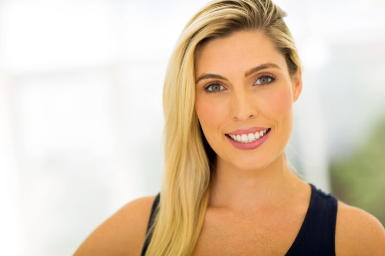 portrait of young blonde woman indoors