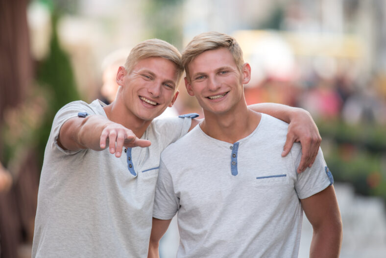 The two happy and attractive twin outdoor