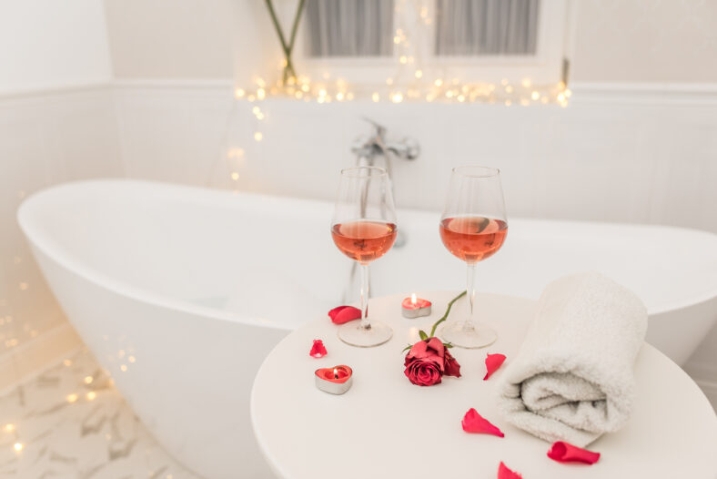 bathtub surrounded with candles, romantic atmosphere