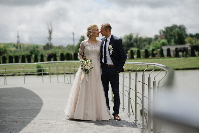 The bride and groom are hugging.