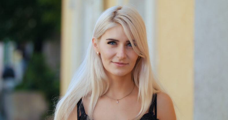 Portrait young attractive smile woman look at camera at city feel happy fashion girl summer face technology sun beautiful.