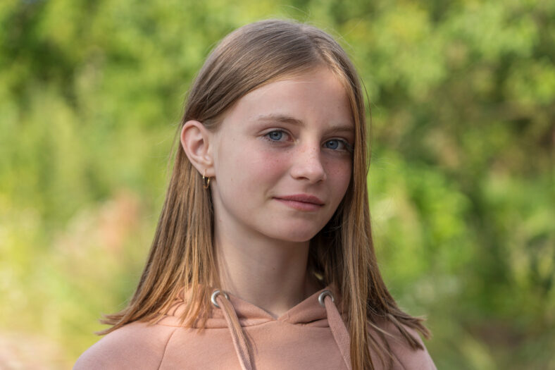 Portrait of a beautiful girl in nature, close up