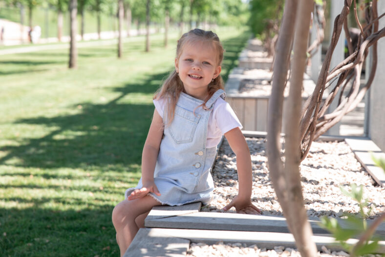 green park. Little girl smiles at the camera. girl is 5 years old. Krasnodar Park