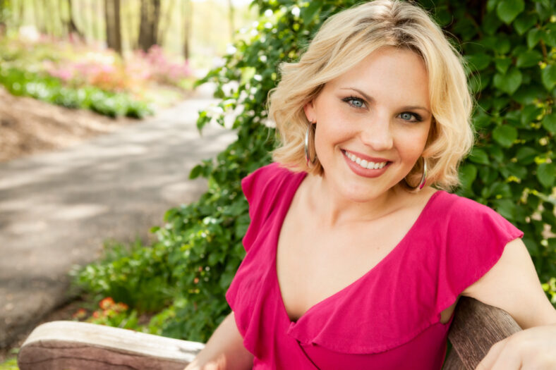 Beautiful woman sitting at a park in spring