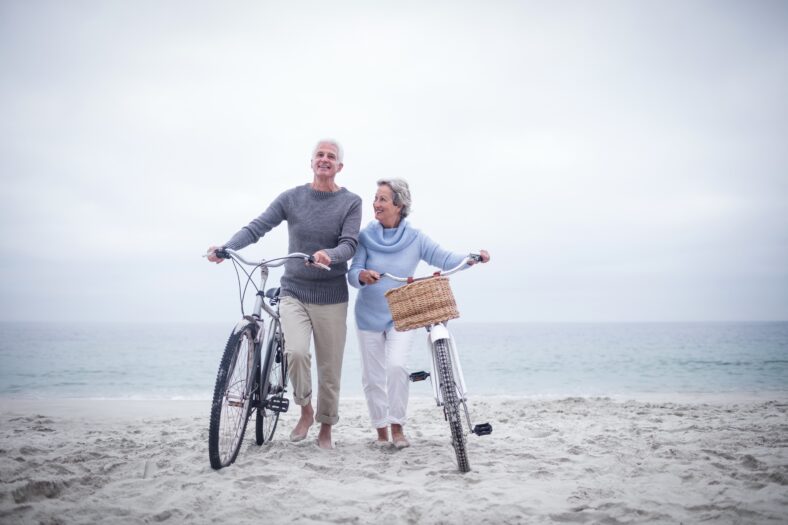 Senior couple having ride with their bike