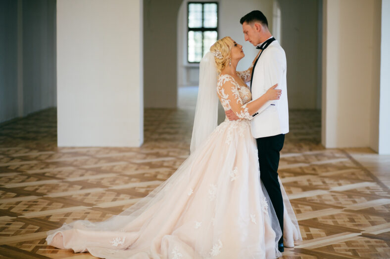 The bride and groom hugging