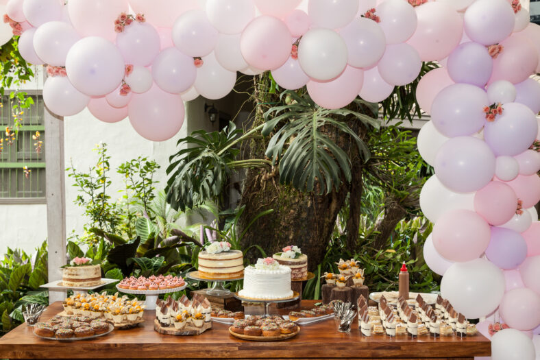 Table with sweets, desserts and cakes, decorated table for reception.