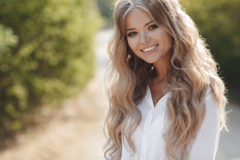 Portrait of a happy beautiful woman in glasses outdoor. High quality photo