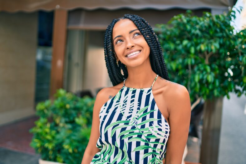 Young african american woman smiling happy walking at the city.