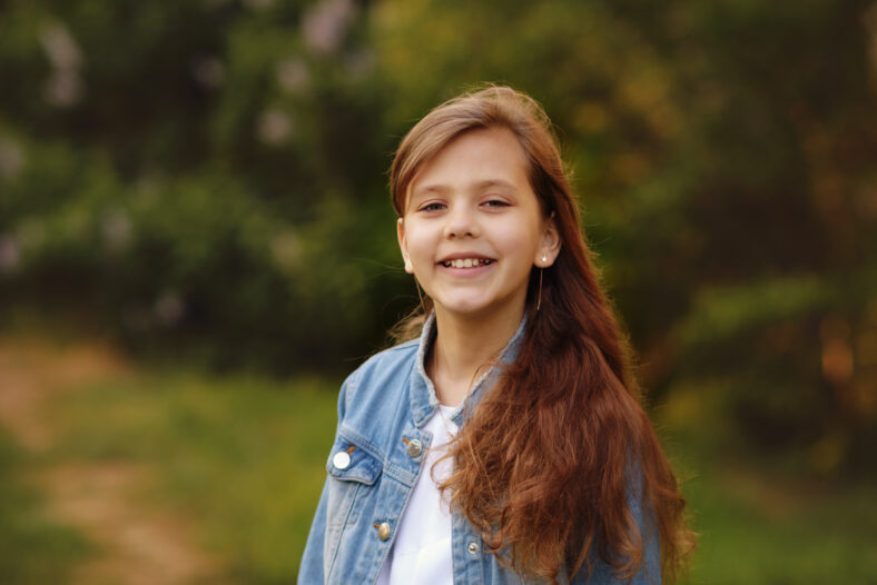 portrait of happy girl in spring day outdoors