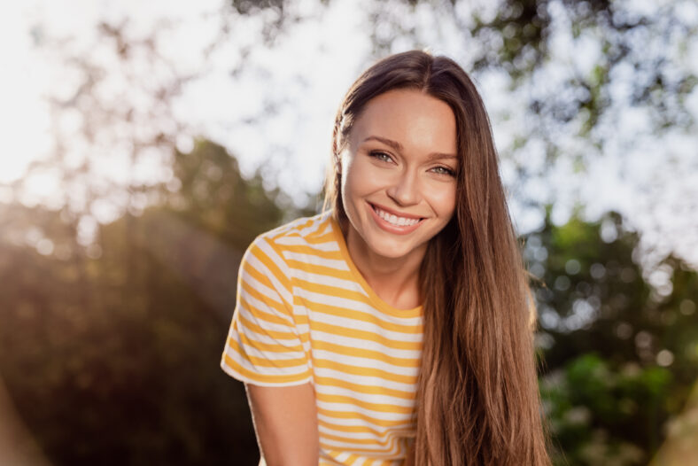 Portrait of attractive cheerful girl having fun spending free spare time vacation holiday festal day outdoors.