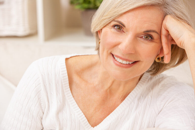 Portrait of an attractive elegant senior woman relaxing at home.