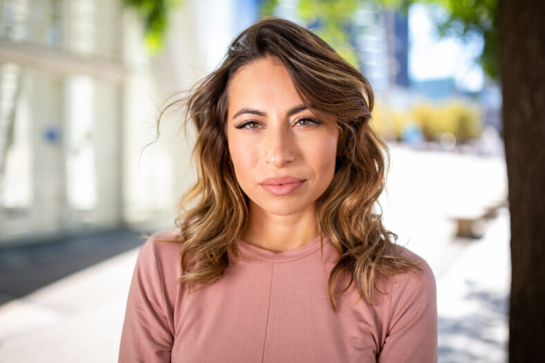 Close up portrait young woman with serious face expression