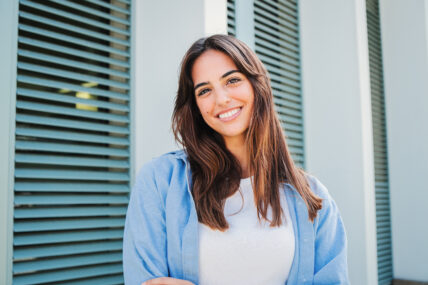 Happy caucasian young student female looking at