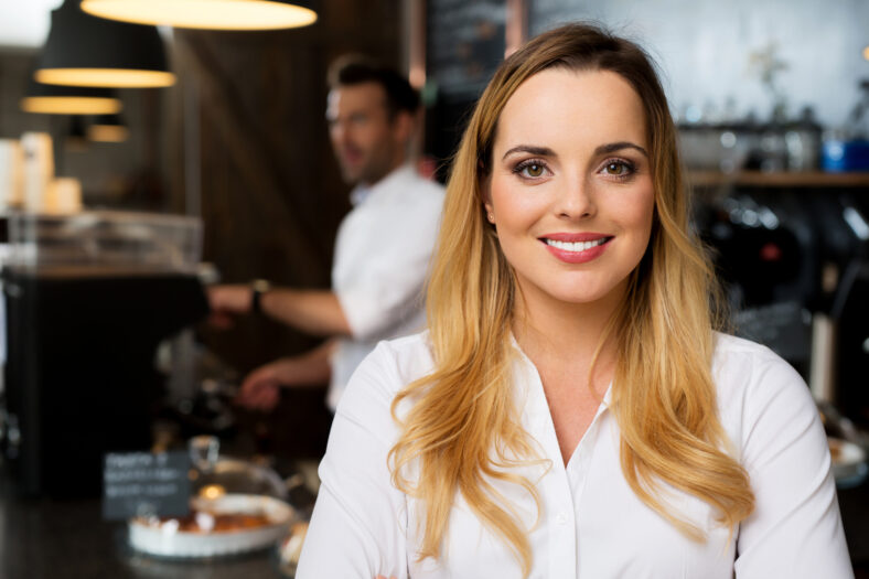 Portrait of happy small business, restaurant owner