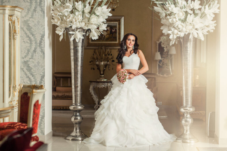 Beauty adult woman bride in white wedding dress in luxury place