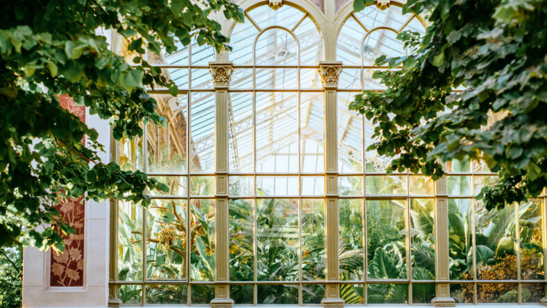 Historic Hivernacle glasshouse exterior with tropical plants in Parc de la Ciutadella, Barcelona