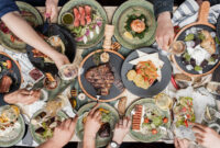 beautifully served table with different restaurant dishes