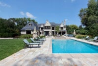 Swimming pool with large deck outside of