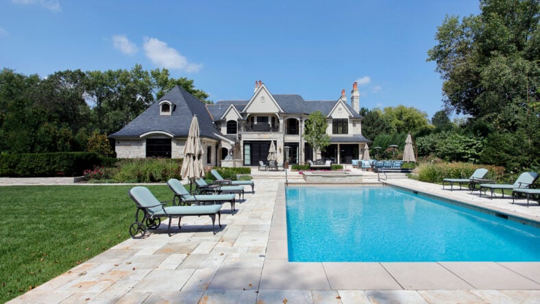 Swimming pool with large deck outside of