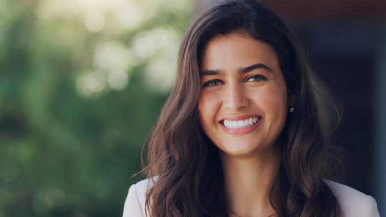 Allow yourself to let go of the negative. a beautiful young woman standing outdoors