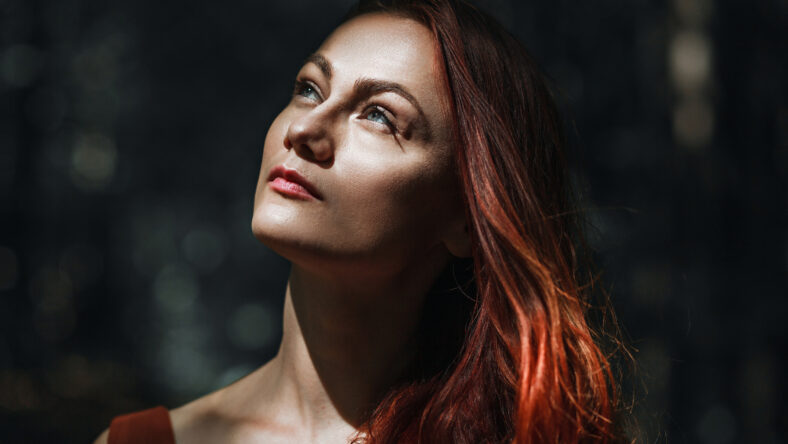 beautiful charming romantic woman with red hair, summer portrait on nature close-up