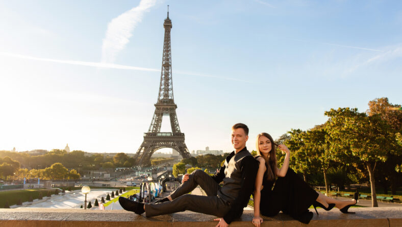 Portrait of happy couple near Eiffel tower in Paris, France