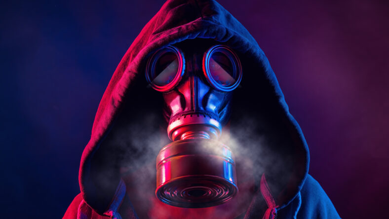 blue and red illuminated person with a gas mask