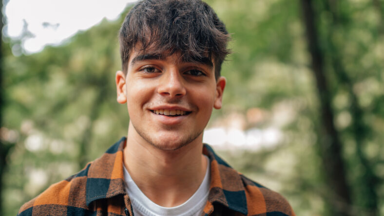 portrait of teenage boy outdoors