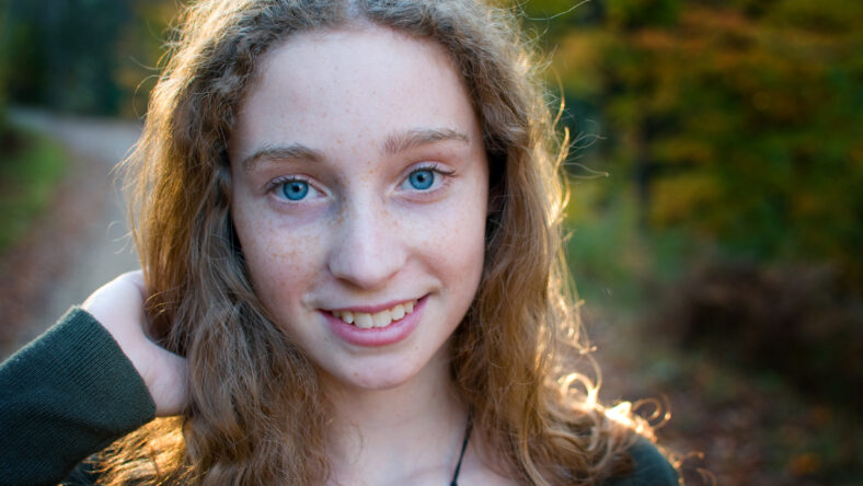 teen girl outdoors in fall