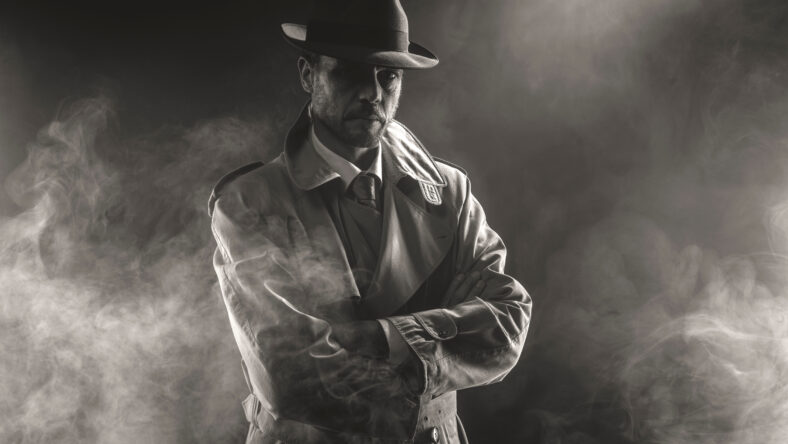 Mysterious man waiting with arms crossed in the fog, 1950s style film noir