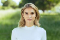 Attractive young blonde Caucasian woman in tight