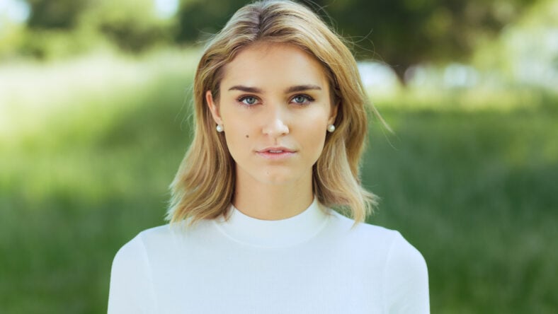 Attractive young blonde Caucasian woman in tight