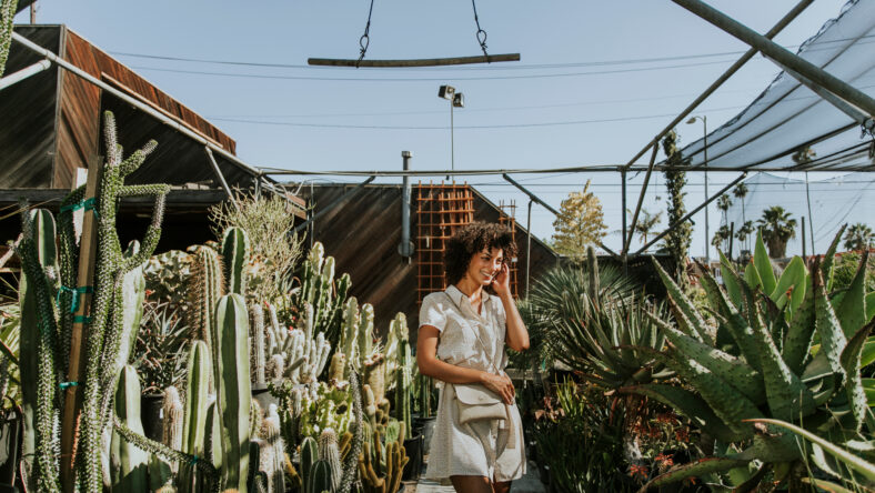 Beautiful woman at a cactus garden