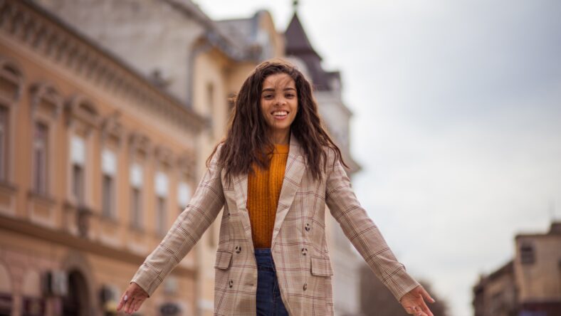 Wonderful city life. African American woman on the street.
