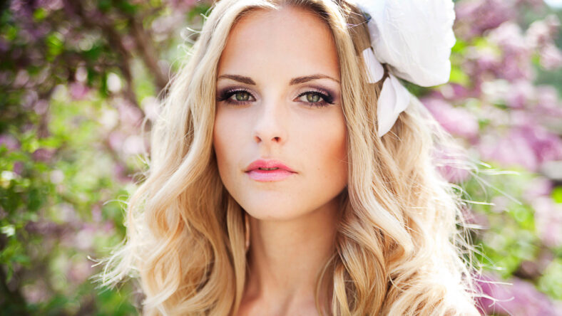 picture of young woman wearing wreath of flowers