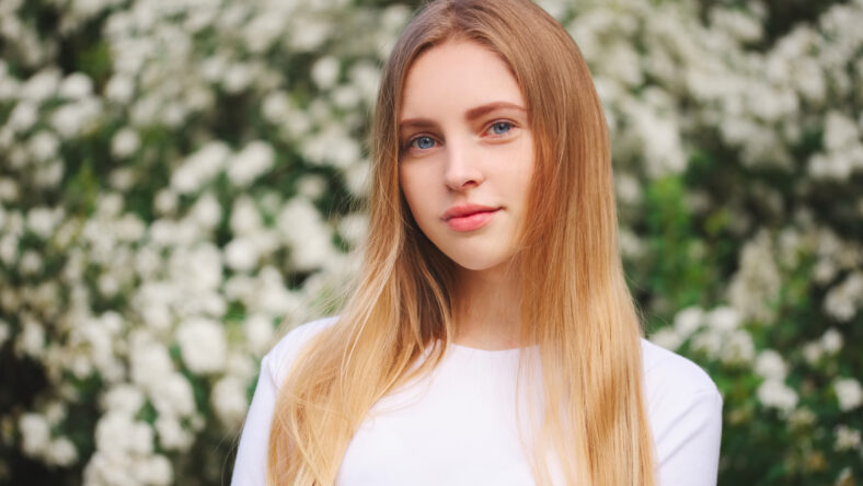 portrait of beautiful blonde girl on the street