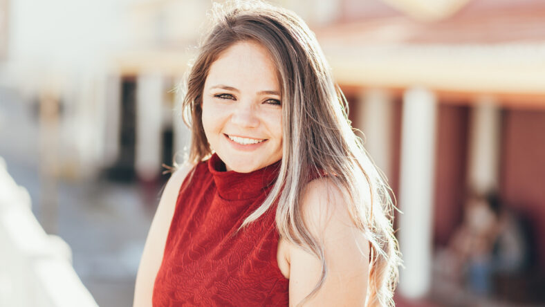 Portrait of happy young woman on sunny day