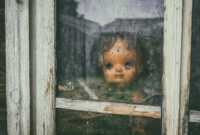 Ghost mystic doll smiling. Scary horror plastic