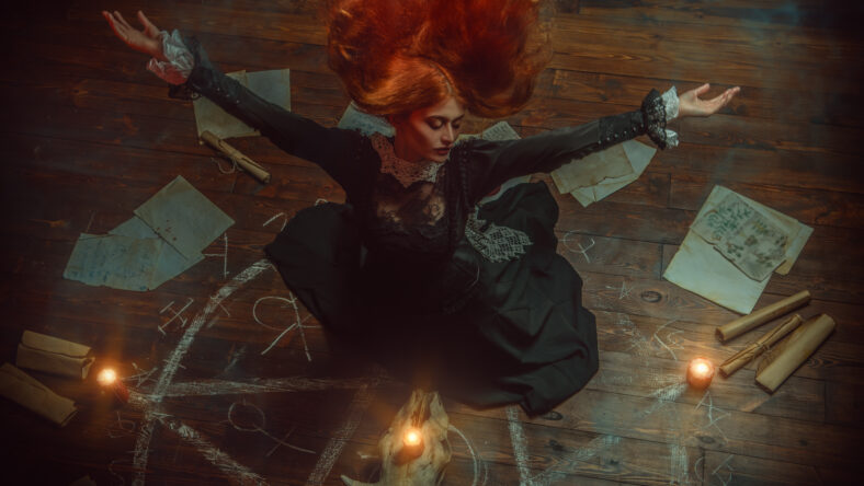 A portrait of a scary witch in the wooden house. Magic, dark force, spell.